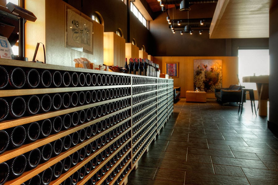 wine bottles on top of each other in the storage locker at 'Domaine Skouras' cellar